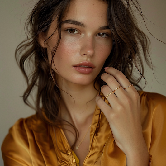 A woman wears sustainable and ethical jewelry